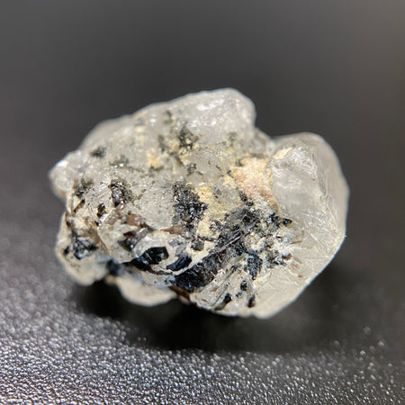 1.95 gram raw Madagascar phenakite crystal with a lot of tourmaline inclusions available at sanctuaryofstones.com