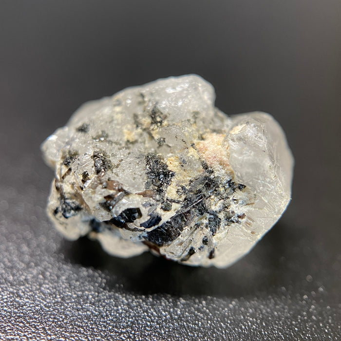 1.95 gram raw Madagascar phenakite crystal with a lot of tourmaline inclusions available at sanctuaryofstones.com