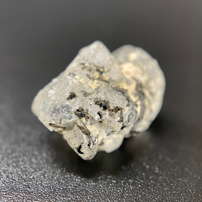 1.95 gram raw Madagascar phenakite crystal with a lot of tourmaline inclusions available at sanctuaryofstones.com