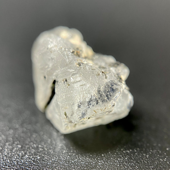 1.95 gram raw Madagascar phenakite crystal with a lot of tourmaline inclusions available at sanctuaryofstones.com