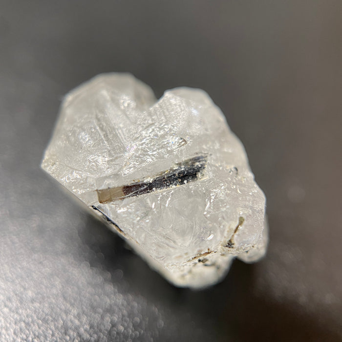 1.95 gram raw Madagascar phenakite crystal with a lot of tourmaline inclusions available at sanctuaryofstones.com