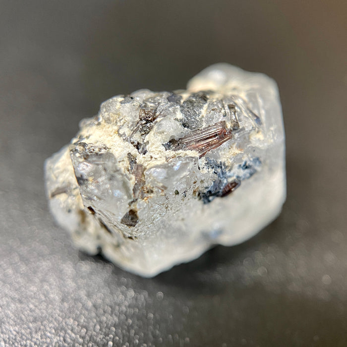 1.95 gram raw Madagascar phenakite crystal with a lot of tourmaline inclusions available at sanctuaryofstones.com