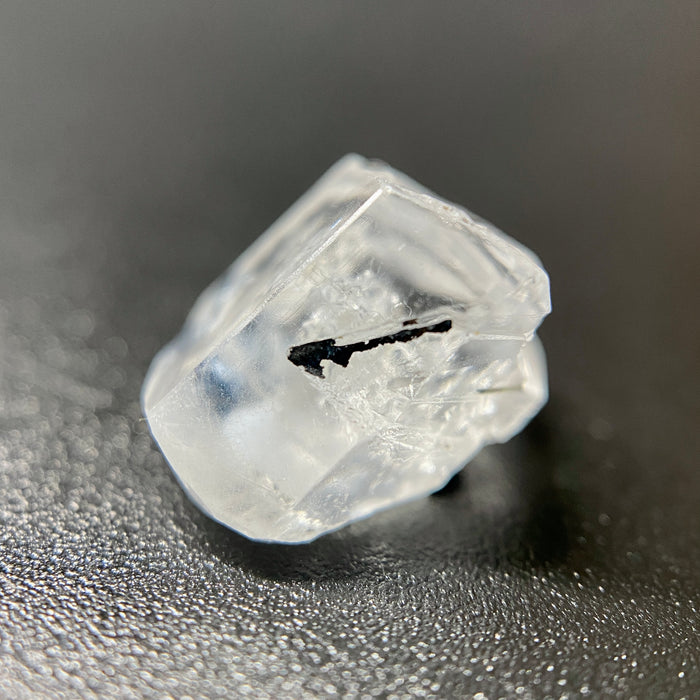 1 gram optically clear raw Madagascar phenakite crystal with tourmaline inclusions available at sanctuaryofstones.com
