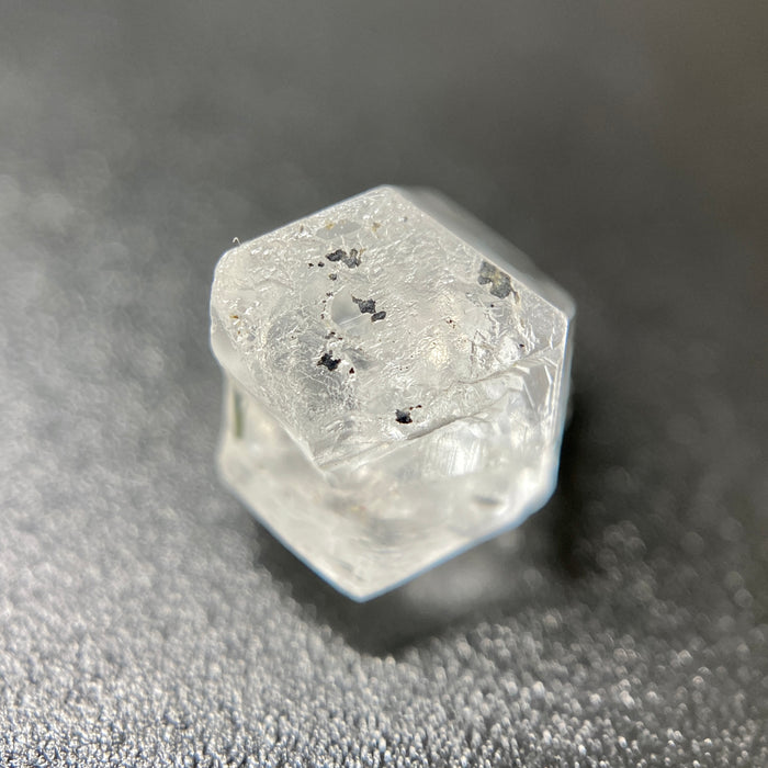 1 gram optically clear raw Madagascar phenakite crystal with tourmaline inclusions available at sanctuaryofstones.com