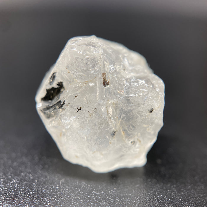 3.90 gram raw Madagascar phenakite crystal with tourmaline inclusions available at sanctuaryofstones.com