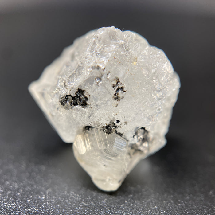 3.90 gram raw Madagascar phenakite crystal with tourmaline inclusions available at sanctuaryofstones.com