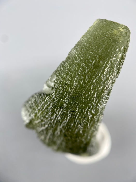 Raw moldavite specimen, authentic tektite 2.512 grams available at sanctuaryofstones.com