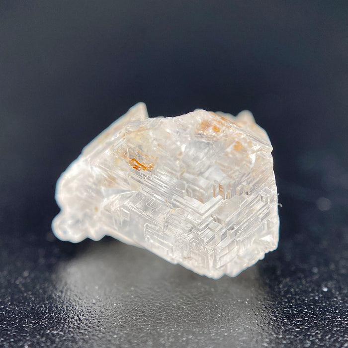 rare Nigerian Okuta-Didan phenakite crystal on black background. available at sanctuaryofstones.com