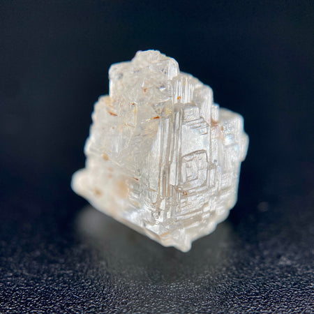 rare Nigerian Okuta-Didan phenakite crystal on black background. available at sanctuaryofstones.com