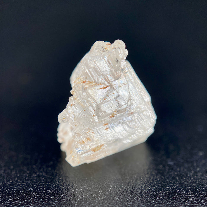 rare Nigerian Okuta-Didan phenakite crystal on black background. available at sanctuaryofstones.com