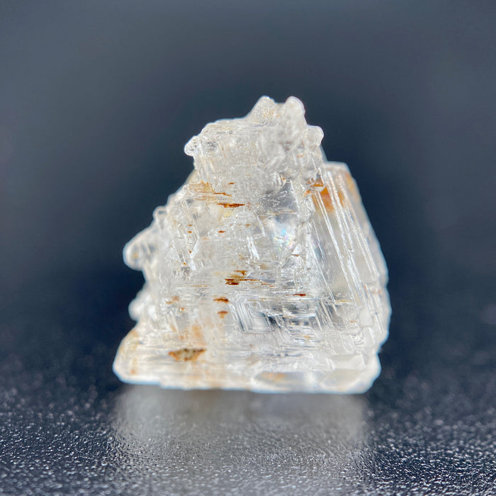 rare Nigerian Okuta-Didan phenakite crystal on black background. available at sanctuaryofstones.com