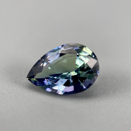 untreated peacock tanzanite pear cut gemstone, 1.88 carats, trichroic color phenomenon with blue, violet, fern-green colors, from sanctuary of stones dot com, image 1