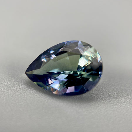 untreated peacock tanzanite pear cut gemstone, 1.88 carats, trichroic color phenomenon with blue, violet, fern-green colors, from sanctuary of stones dot com, image 2