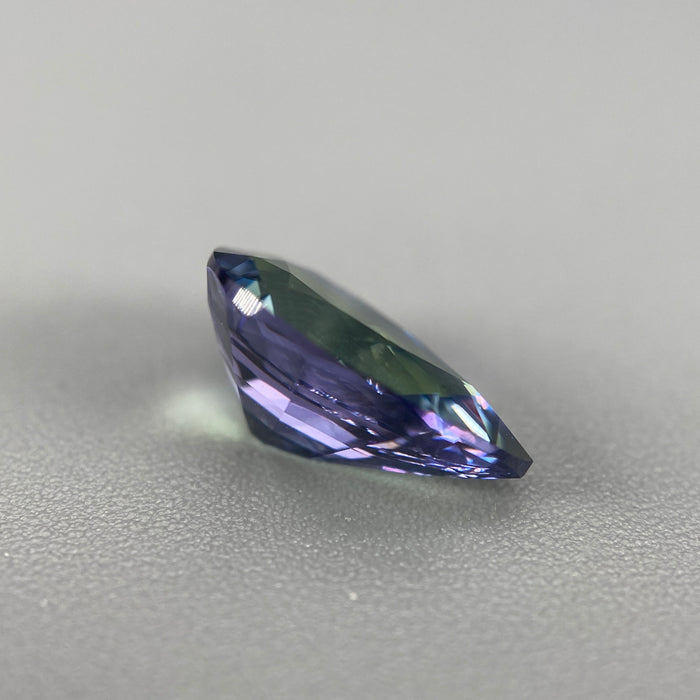 untreated peacock tanzanite pear cut gemstone, 1.88 carats, trichroic color phenomenon with blue, violet, fern-green colors, from sanctuary of stones dot com, image 7