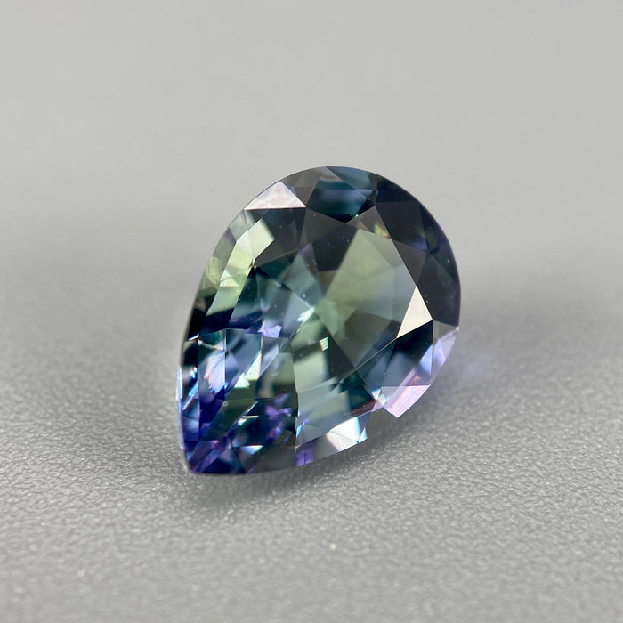 untreated peacock tanzanite pear cut gemstone, 1.88 carats, trichroic color phenomenon with blue, violet, fern-green colors, from sanctuary of stones dot com, image 5
