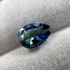 untreated peacock tanzanite pear cut gemstone, 1.88 carats, trichroic color phenomenon with blue, violet, fern-green colors, from sanctuary of stones dot com, image 9