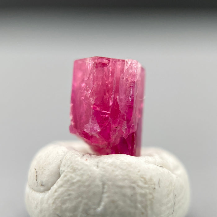 extremely rare red beryl (bixbite) crystal raspberry red hexagonal crystal of 0.56 carats available at sanctuaryofstones.com