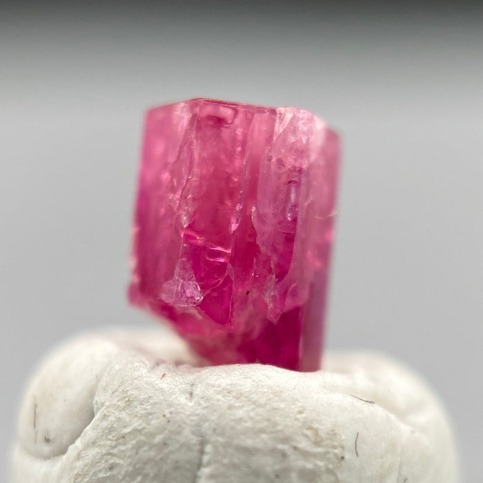extremely rare red beryl (bixbite) crystal raspberry red hexagonal crystal of 0.56 carats available at sanctuaryofstones.com