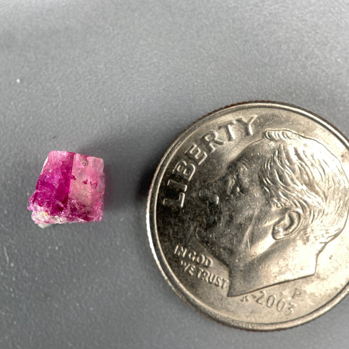 Extremely rare red beryl crystal 0.59 carats, broken crystal shape, raspberry red color great translucency, available at sanctuaryofstones.com