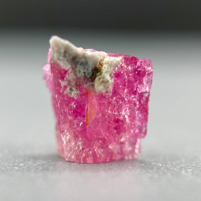 Extremely rare red beryl crystal 0.59 carats, broken crystal shape, raspberry red color great translucency, available at sanctuaryofstones.com