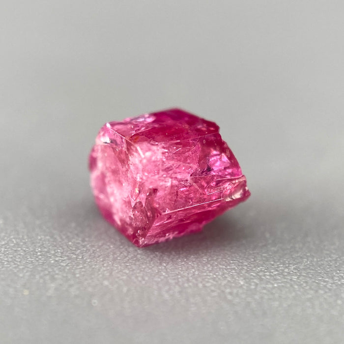 Extremely rare red beryl crystal 0.71 carats, hexagonal shape, raspberry red color great translucency, available at sanctuaryofstones.com