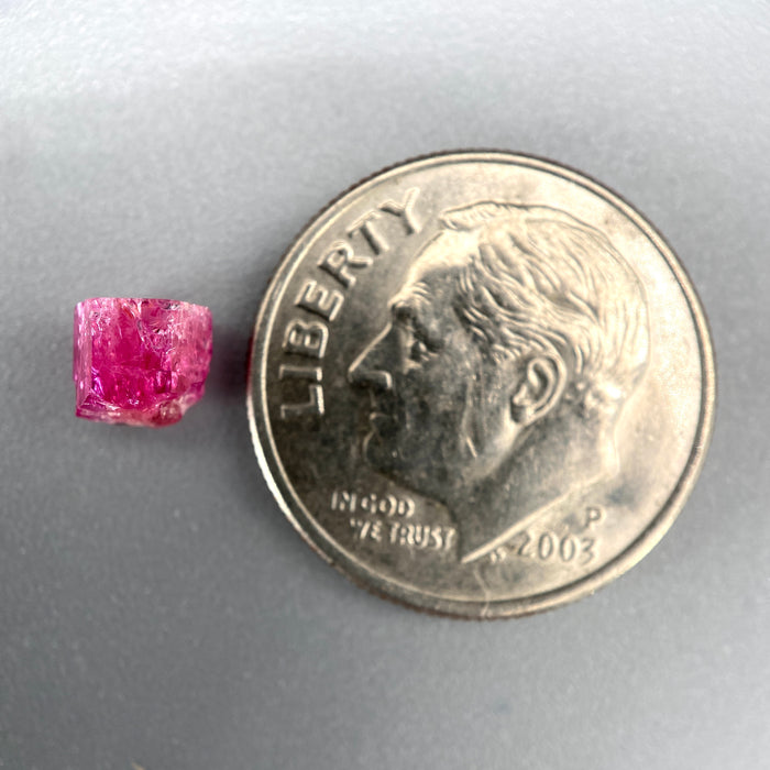 Extremely rare red beryl crystal 0.71 carats, hexagonal shape, raspberry red color great translucency, available at sanctuaryofstones.com