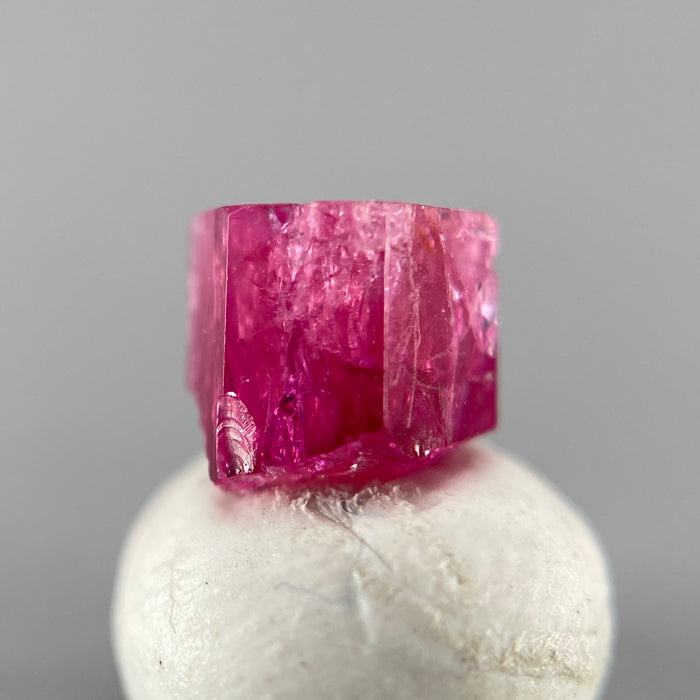 Extremely rare red beryl crystal 0.71 carats, hexagonal shape, raspberry red color great translucency, available at sanctuaryofstones.com