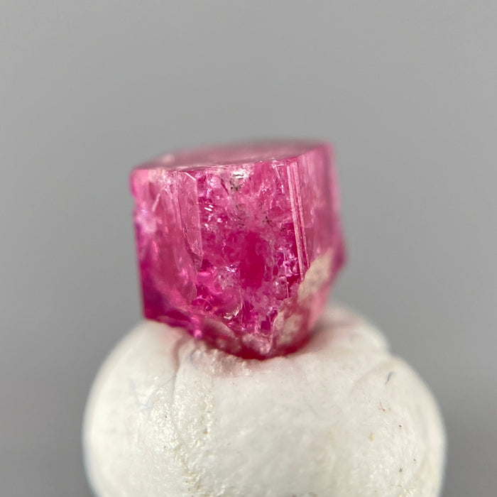 Extremely rare red beryl crystal 0.71 carats, hexagonal shape, raspberry red color great translucency, available at sanctuaryofstones.com