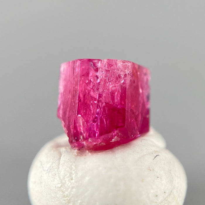 Extremely rare red beryl crystal 0.71 carats, hexagonal shape, raspberry red color great translucency, available at sanctuaryofstones.com