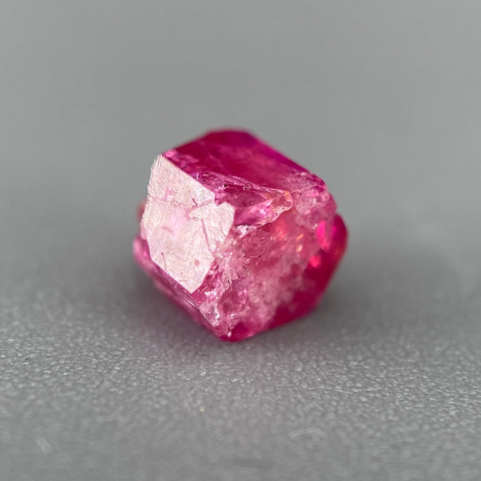 Extremely rare red beryl crystal 0.71 carats, hexagonal shape, raspberry red color great translucency, available at sanctuaryofstones.com