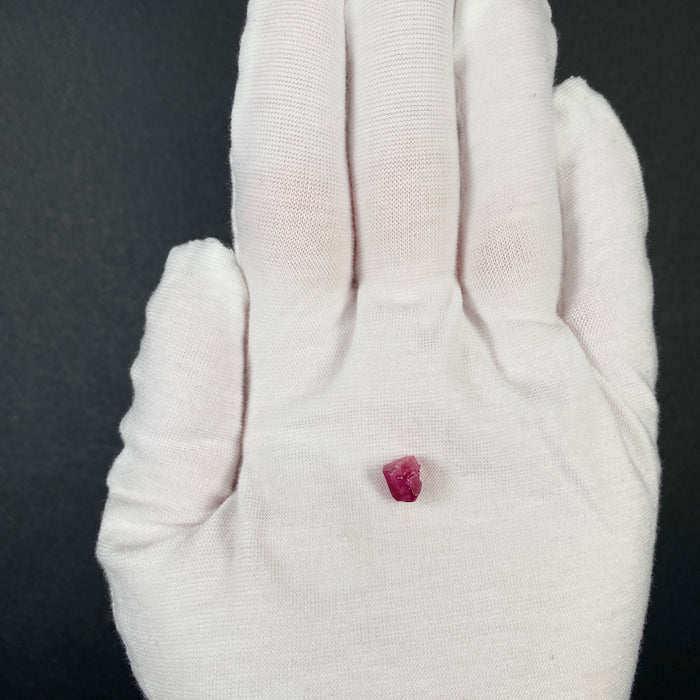 Extremely rare red beryl crystal 1.55 carats, broken but with two natural crystal faces, richest top-tier raspberry red color great translucency, available at sanctuaryofstones.com