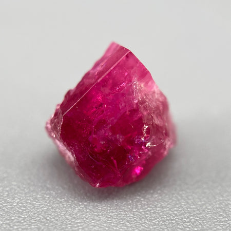 Extremely rare red beryl crystal 1.55 carats, broken but with two natural crystal faces, richest top-tier raspberry red color great translucency, available at sanctuaryofstones.com