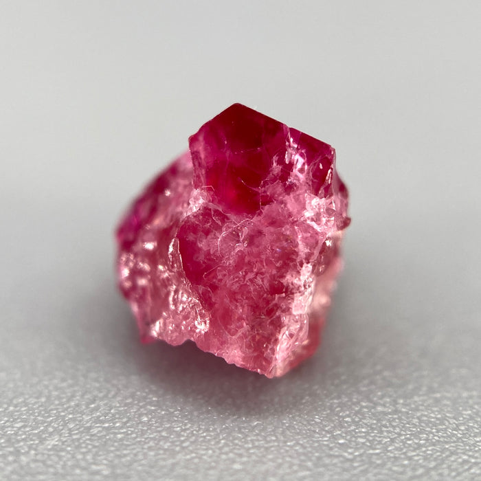 Extremely rare red beryl crystal 1.55 carats, broken but with two natural crystal faces, richest top-tier raspberry red color great translucency, available at sanctuaryofstones.com