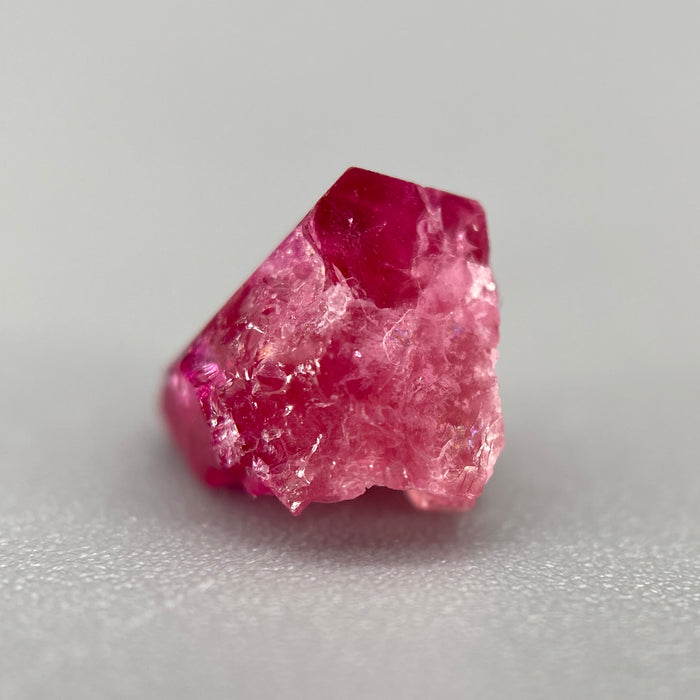 Extremely rare red beryl crystal 1.55 carats, broken but with two natural crystal faces, richest top-tier raspberry red color great translucency, available at sanctuaryofstones.com