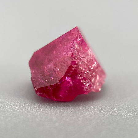 Extremely rare red beryl crystal 1.55 carats, broken but with two natural crystal faces, richest top-tier raspberry red color great translucency, available at sanctuaryofstones.com
