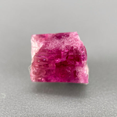 Extremely rare red beryl crystal on matrix, 1.67 carats, two natural crystal faces, raspberry red color great translucency, available at sanctuaryofstones.com
