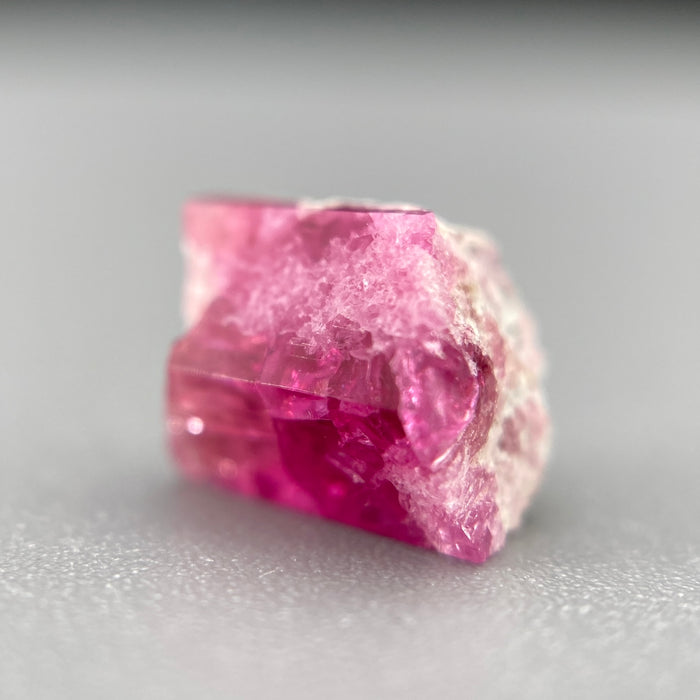 Extremely rare red beryl crystal on matrix, 1.67 carats, two natural crystal faces, raspberry red color great translucency, available at sanctuaryofstones.com