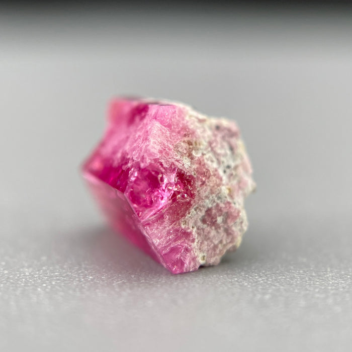 Extremely rare red beryl crystal on matrix, 1.67 carats, two natural crystal faces, raspberry red color great translucency, available at sanctuaryofstones.com