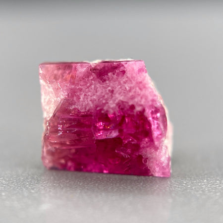 Extremely rare red beryl crystal on matrix, 1.67 carats, two natural crystal faces, raspberry red color great translucency, available at sanctuaryofstones.com