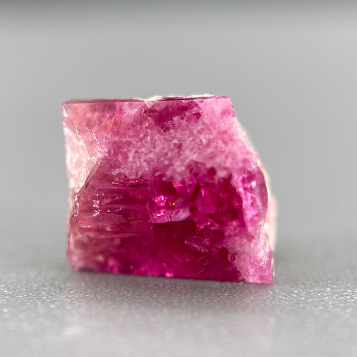 Extremely rare red beryl crystal on matrix, 1.67 carats, two natural crystal faces, raspberry red color great translucency, available at sanctuaryofstones.com