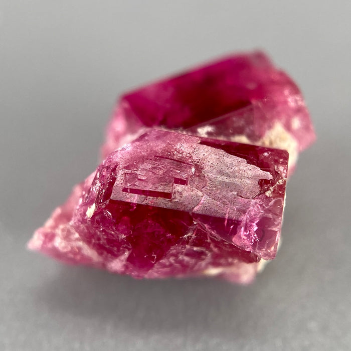 Extremely rare red beryl twin crystal 2.22 carats, hexagonal shape twins, raspberry red color great translucency, available at sanctuaryofstones.com