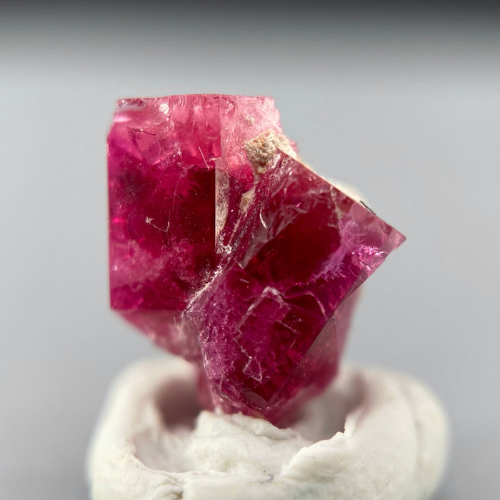 Extremely rare red beryl twin crystal 2.22 carats, hexagonal shape twins, raspberry red color great translucency, available at sanctuaryofstones.com