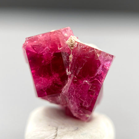 Extremely rare red beryl twin crystal 2.22 carats, hexagonal shape twins, raspberry red color great translucency, available at sanctuaryofstones.com
