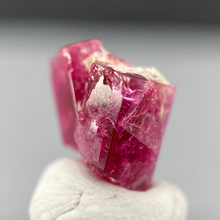 Extremely rare red beryl twin crystal 2.22 carats, hexagonal shape twins, raspberry red color great translucency, available at sanctuaryofstones.com