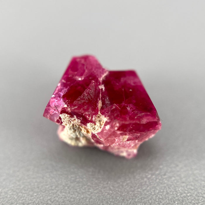 Extremely rare red beryl twin crystal 2.22 carats, hexagonal shape twins, raspberry red color great translucency, available at sanctuaryofstones.com