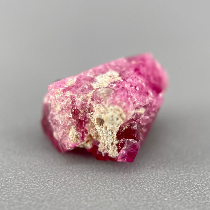 Extremely rare red beryl twin crystal 2.22 carats, hexagonal shape twins, raspberry red color great translucency, available at sanctuaryofstones.com