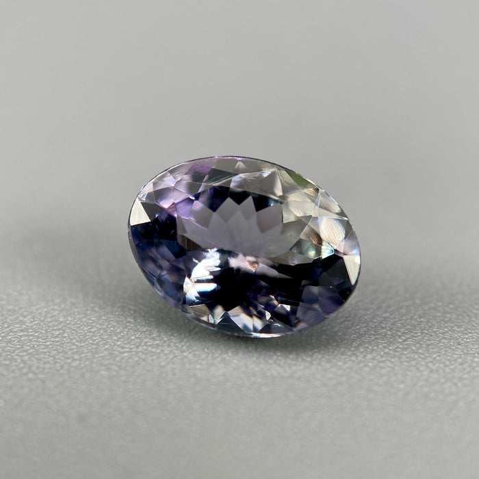 Unheated peacock tanzanite oval gemstone weighing 1.21 carats available on sanctuary of stones dot com photo 3