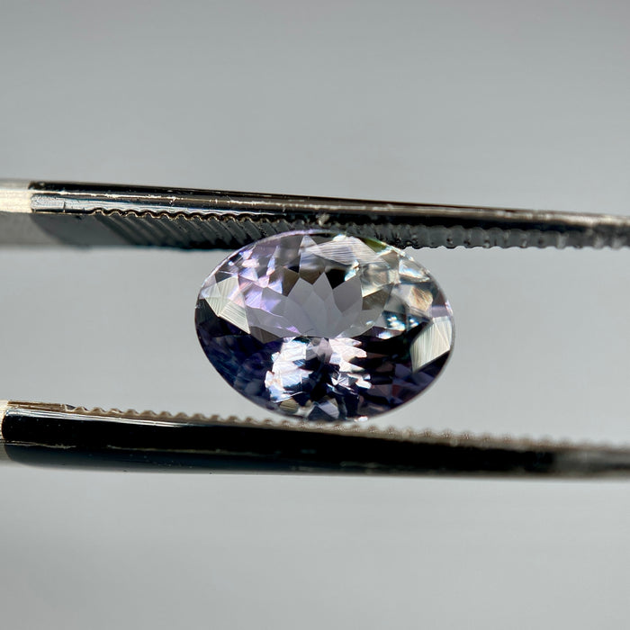 Unheated peacock tanzanite oval gemstone weighing 1.21 carats available on sanctuary of stones dot com photo 7