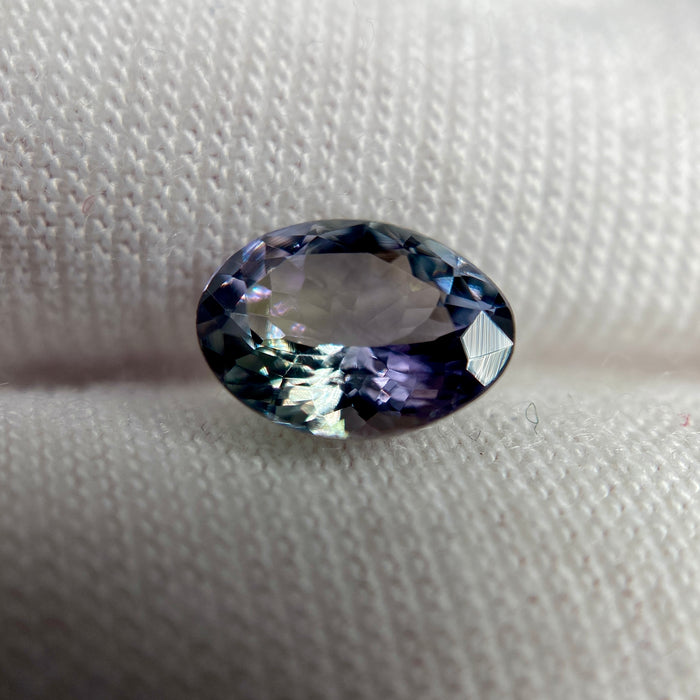 Unheated peacock tanzanite oval gemstone weighing 1.21 carats available on sanctuary of stones dot com photo 9