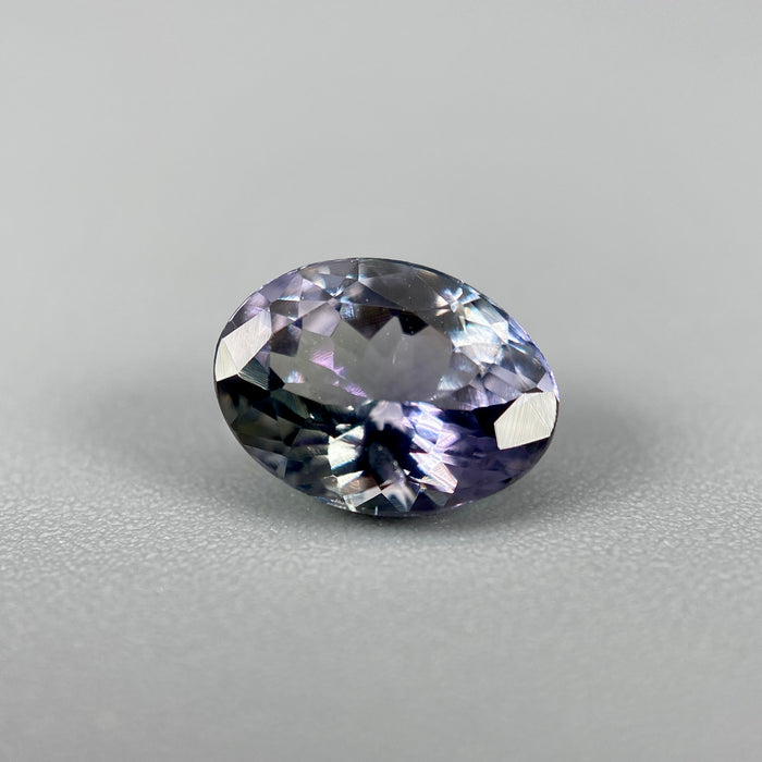 Unheated peacock tanzanite oval gemstone weighing 1.21 carats available on sanctuary of stones dot com photo 1